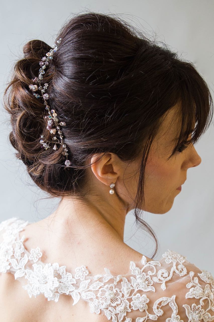 Honesty Vine at the back of an updo wedding hairstyle in brunette hair