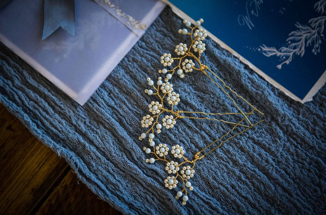 3 hairpins with pearls and pale blue for a blue inspired wedding