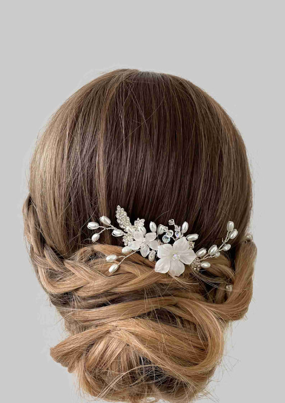 bridal up do with a bridal comb with ivory flowers and freshwater style pearls