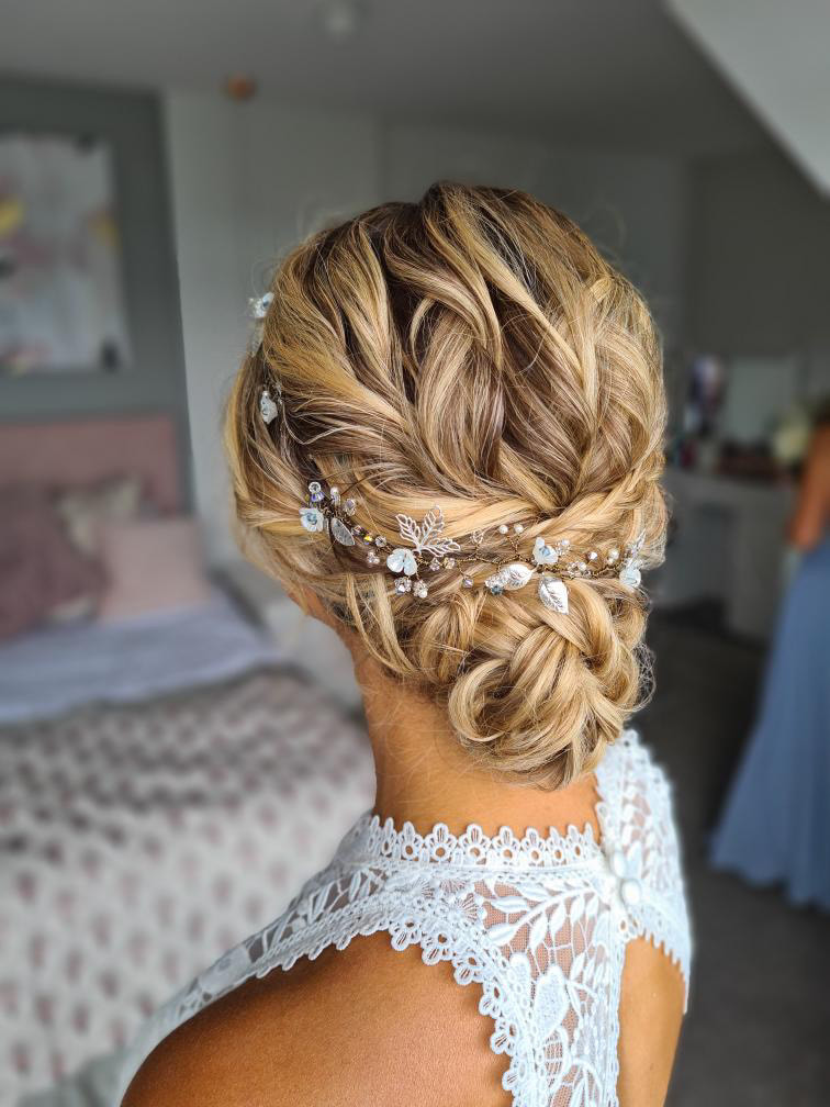 Bridal hair textured undo with silver leaf hair vine