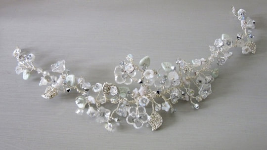 Jasmin bridal headpiece has pretty flowers with a soft subtle colour palette of silver and white