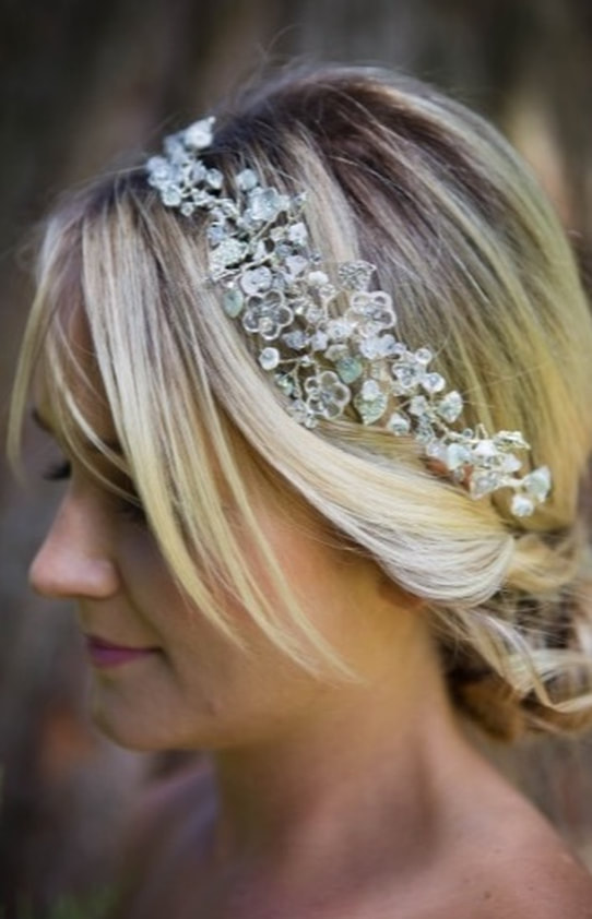 Jasmin bridal headpiece has pretty flowers with a soft subtle colour palette of silver and white in blonde wedding hair