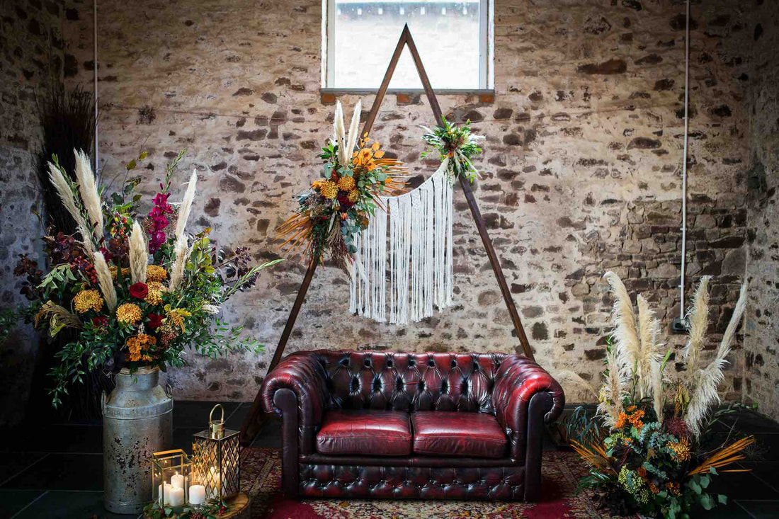 Boho Autumn wedding Decor, macrame, leather sofa, backdrop