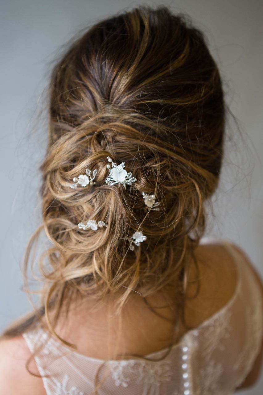 Matilda Hairpin Set in the back of a messy updo wedding hair style
