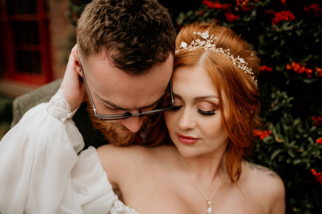recent Hey Jules bride wearing a gold leaf hair vine with mother of pearl flippers, pearl and a little sparkle, pearl drop necklace, auburn hair, on her wedding day